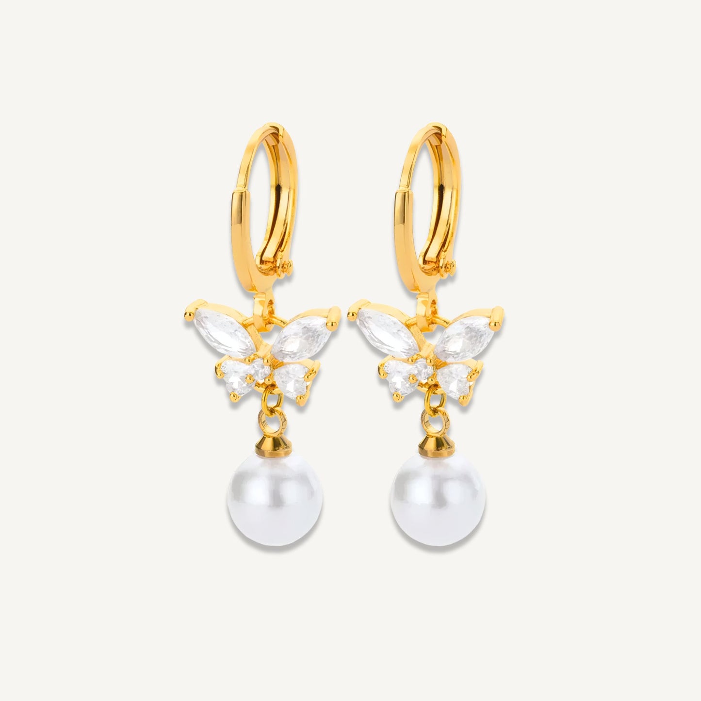 Gold-plated Celeste Butterfly Pearl Drop Earrings with zircon detail shown in a white background
