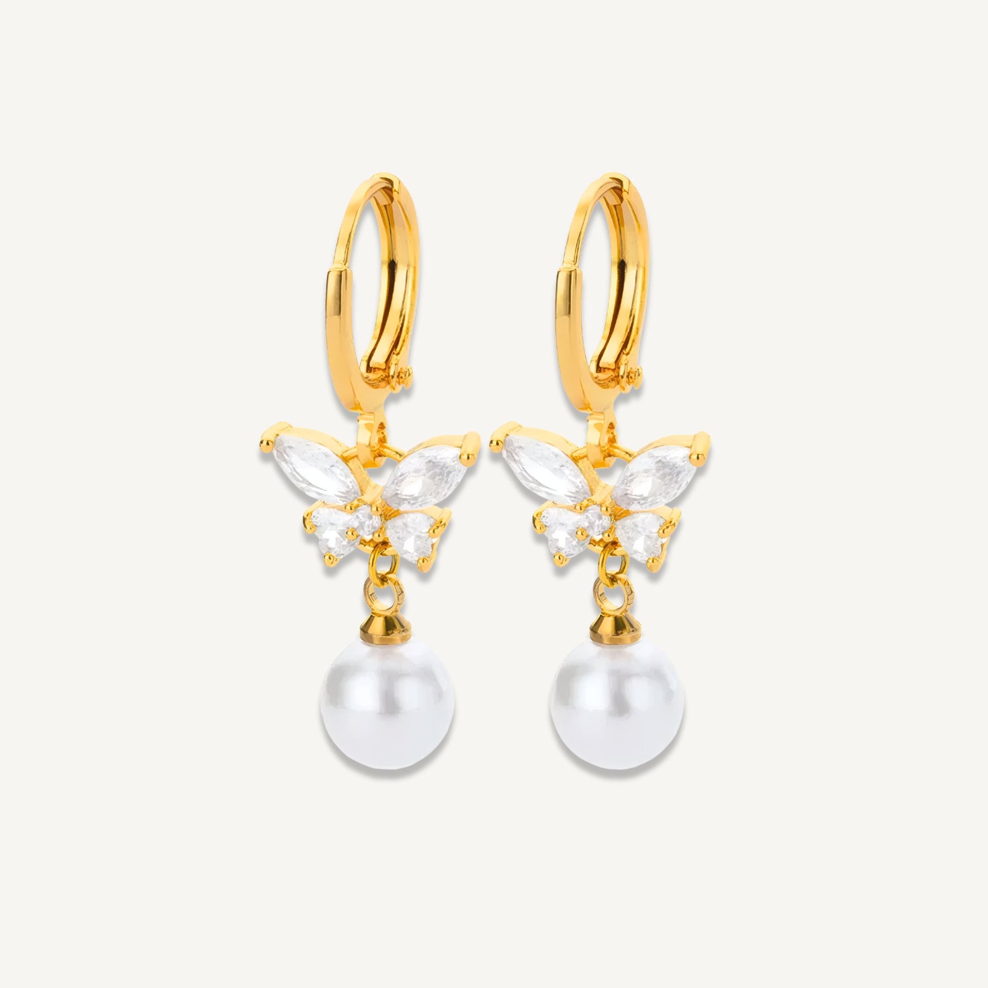 Gold-plated Celeste Butterfly Pearl Drop Earrings with zircon detail shown in a white background